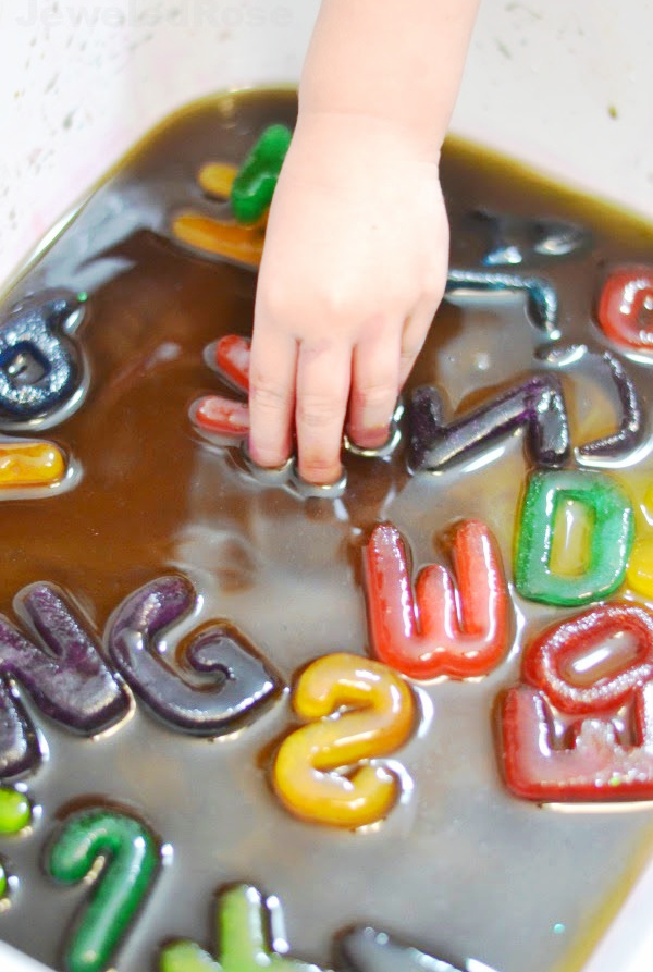 Keep kids cool while engaged in learning with easy to make alphabet ice! #alphabetletters #alphabetactivities #alphabetcrafts #koolaidicecubes #icepainting #growingajeweledrose #activitiesforkids