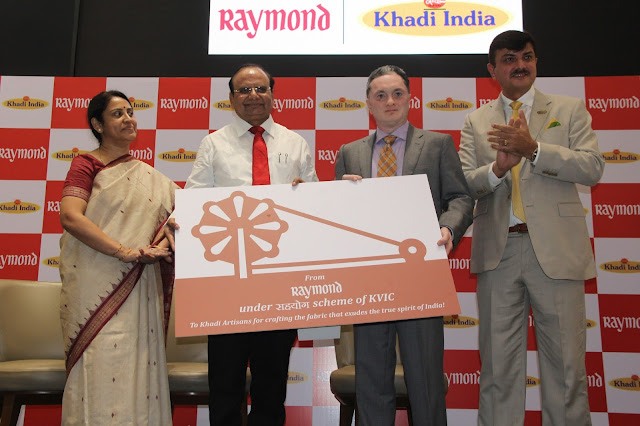   Raymond Ltd. donates 50 charkhas: Ms. Usha Suresh, CEO, KVIC, Shri Vinai Kumar Saxena, Chairman KVIC,  Shri Gautam Hari Singhania, Chairman & Managing Director, Raymond Ltd. , Mr. Sanjay Behl, CEO Raymond Ltd.
