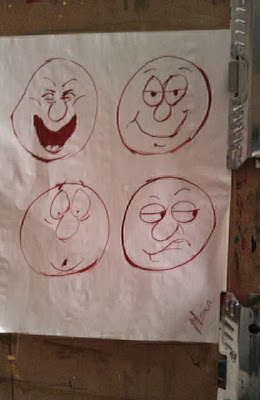 Cartoon faces in red ink drawn by Gloria Poole / Gloria in Atlanta, Ga 1995