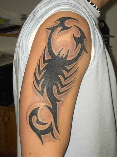 Depending on the design a scorpion tattoo can be dark and forbidding 