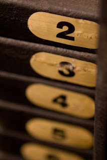 Short depth of field photo of numbers on a weight machine