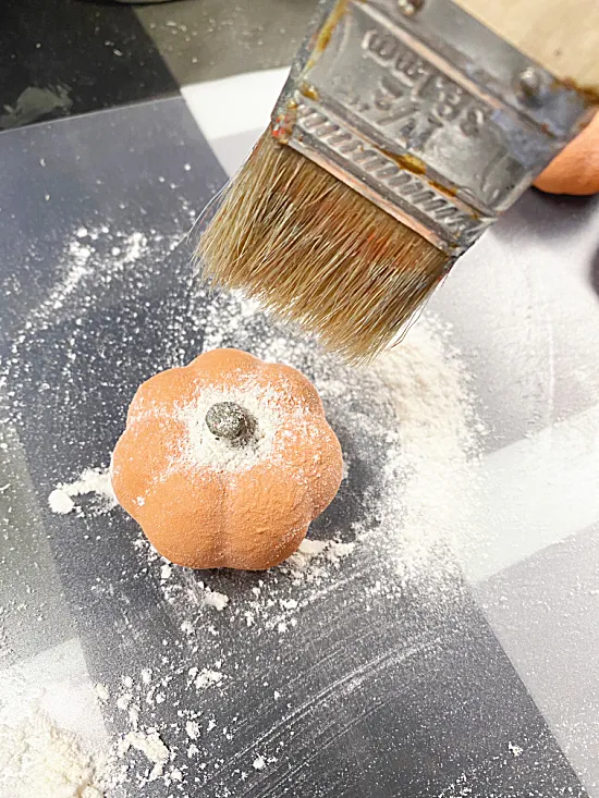 paintbrush and floured pumpkins