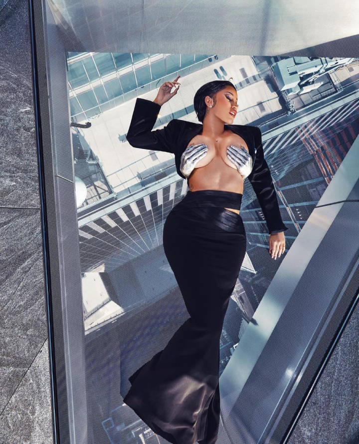 Photos as Card B show off her boobs on braless and topless for XXL magazine shoot