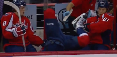 Mike Green flies headfirst into bench