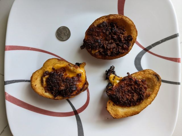 Kroger Loaded Potato Skins next to a quarter.