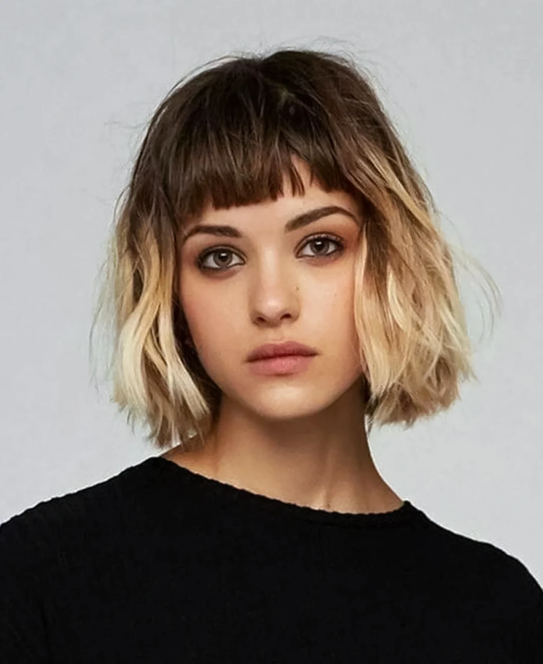 woman with short bob hair and short bangs