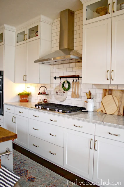 white kitchen with white wavy subway tile