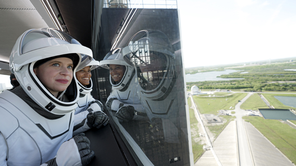 Inspiration4 chief medical officer Hayley Arceneaux and pilot Dr. Sian Proctor enjoy the view outside the Crew Access Arm at Kennedy Space Center's Launch Complex 39A in Florida...on September 15, 2021.