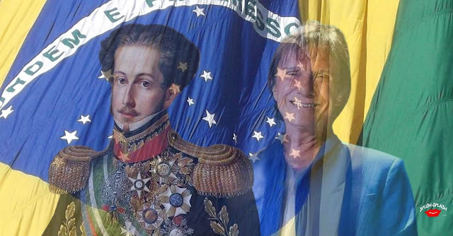 D. Pedro I e Roberto Carlos, tendo por fundo a bandeira do brasil
