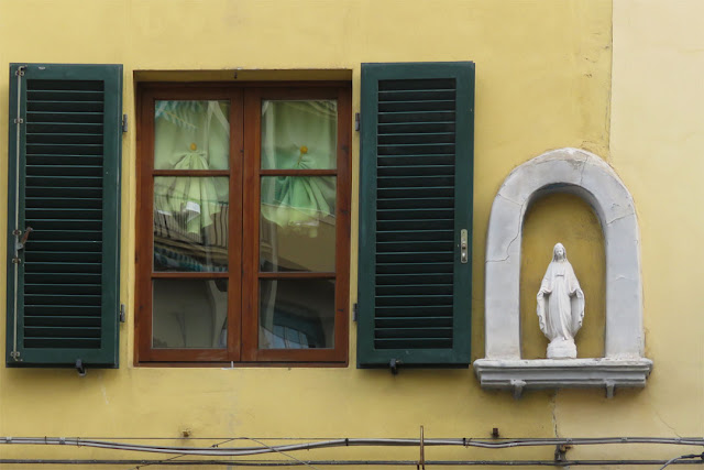 Window with louvered shutters and votive shrine, Via dell'Origine, Livorno