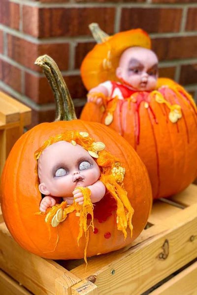 Put the doll inside the pumpkin