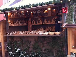 wood carving sales stand on the christmas market