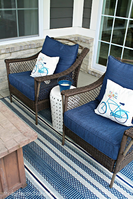 Blue, white and aqua outdoor decor on covered patio