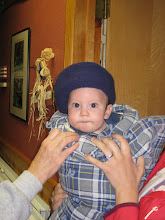 Elias looks like a little mushroom as we have bundled him up to go outside.