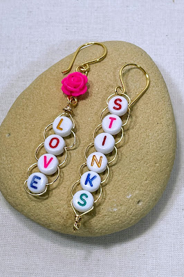 Love Stinks letter bead earrings