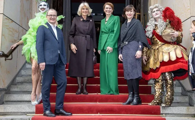 Queen Camilla and First Lady Elke Büdenbender visited the Komishe Oper in Berlin. Green blazer and brown wool coat