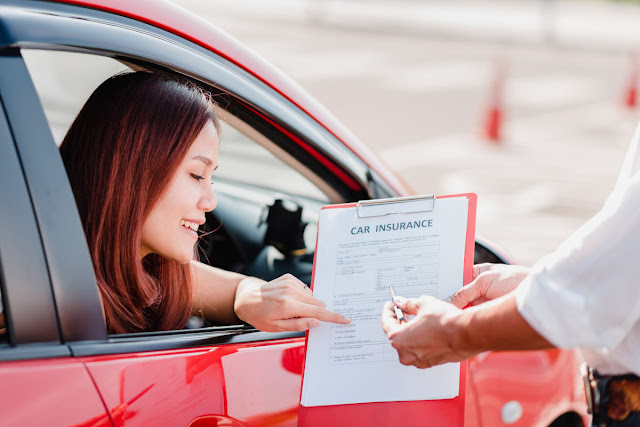 a woman paying when her rent a car