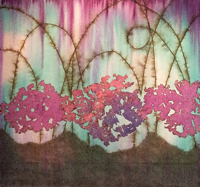 Fragrant Bloom, by Mira Lehr (2022). Burned & dyed Japanese paper, acrylic ink, burnt fuses on canvas (64” x 68”).