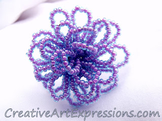 http://www.creativeartexpressions.com/product/creative-art-expressions-handmade-purple-aqua-seed-bead-flower-ring-jewelry-design?tid=9