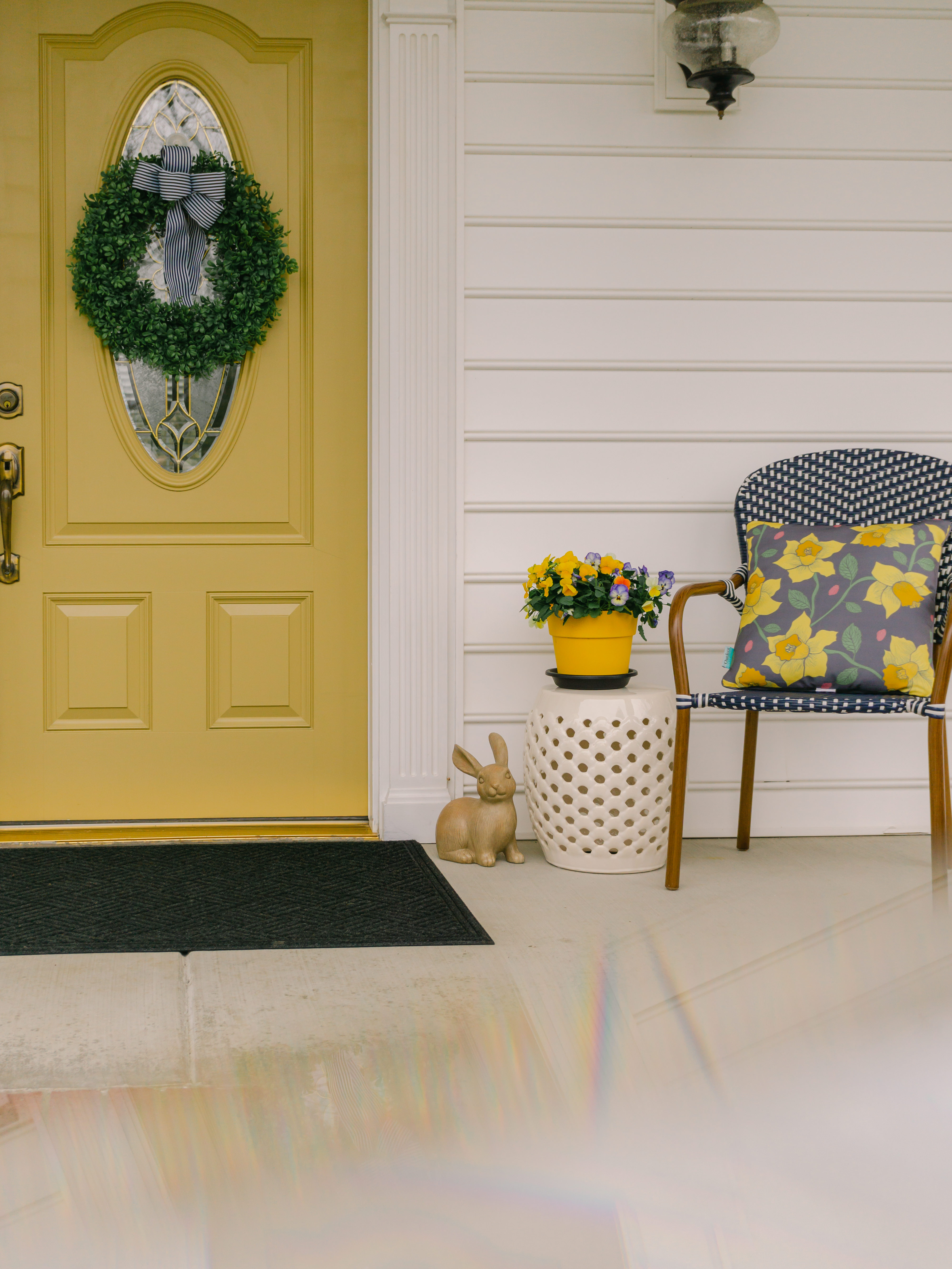 Spring front porch with yellow front door