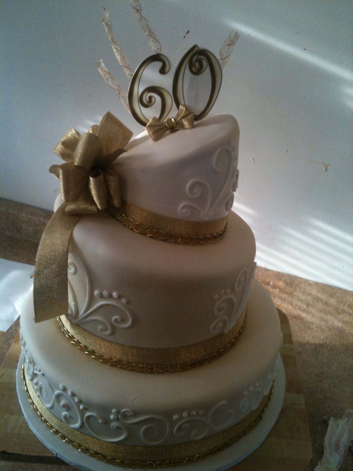 Hector's Custom Cakes: 60th birthday gold edition topsy turvy