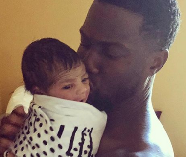Kevin Hart says a prayer for his newborn son as he shows off his face for the first time