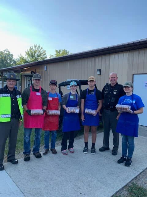 sheriffs standing in front of a side by side