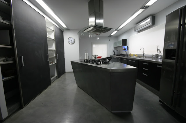 Modern black kitchen in the Waterfall House