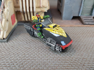 Judge Dredd rides his Lawmaster bike