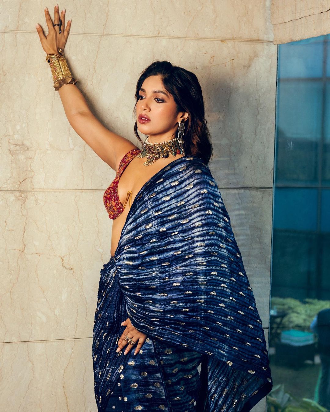 Bhumi Pednekar dazzles in a jaw-dropping bralette blouse and a statement saree at a friend's wedding.