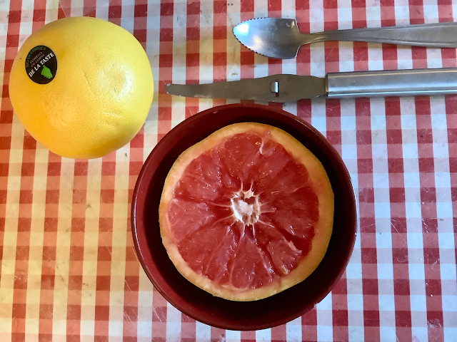 Breakfast half of pink grapefruit