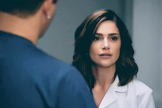 A lady doctor seen in contemplating mood