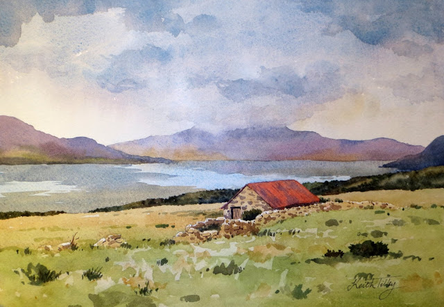 View over a sea loch with a red-roofed barn in the foreground