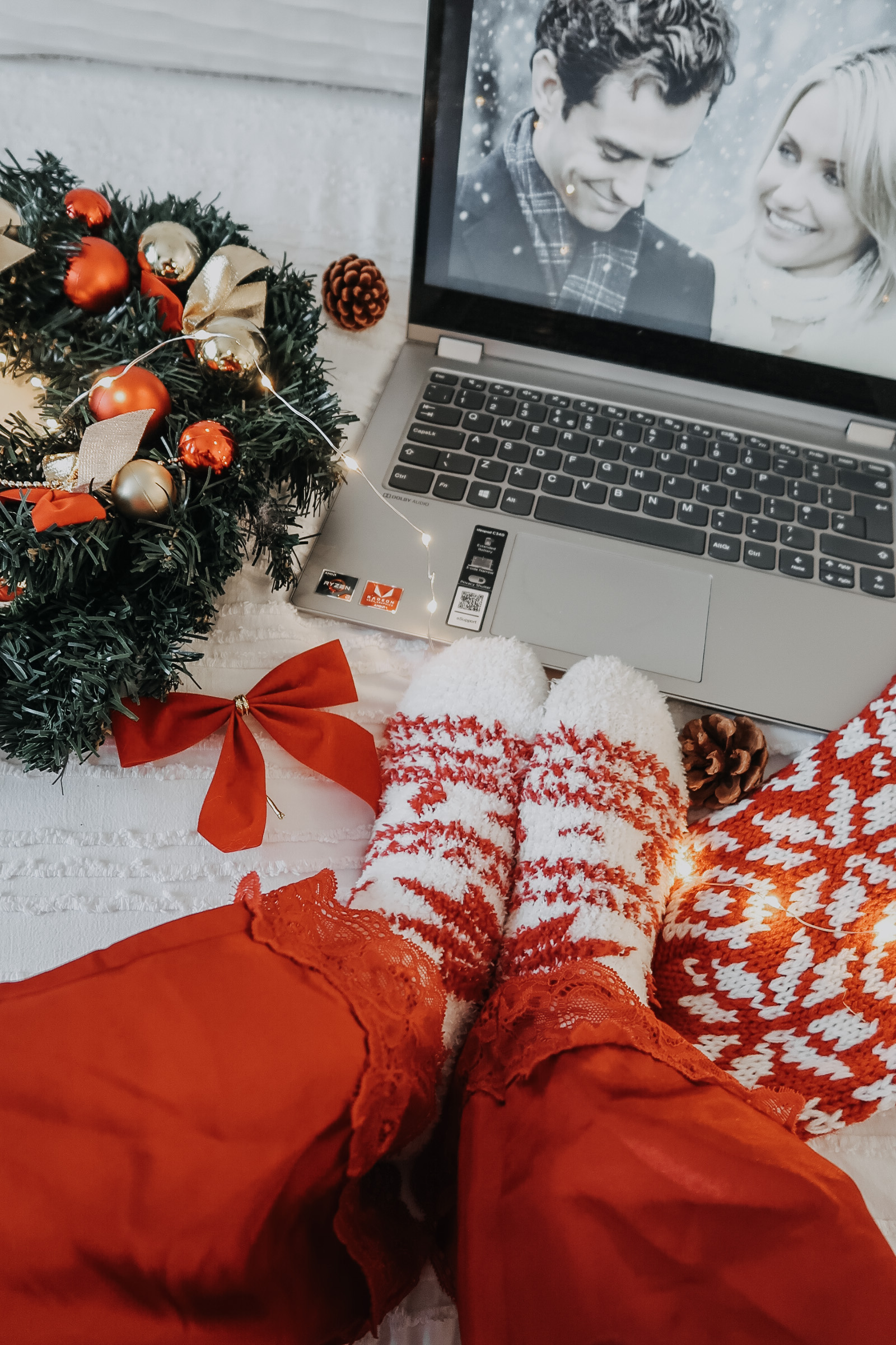 A laptop with the movie 'The Holiday' on screen.