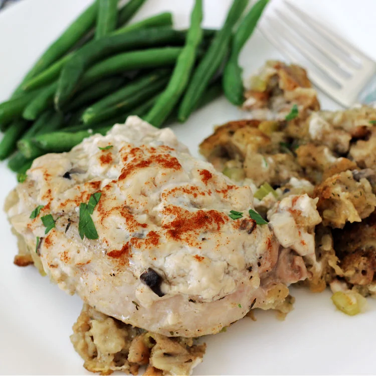 Plated pork chops and stuffing bake recipe with green beans