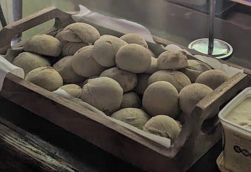 A tray of warm morgenboller (breakfast rolls) brought by a fan