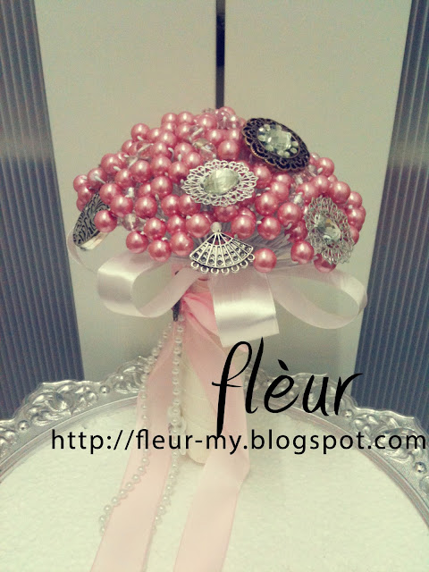 Pink Pearl and Brooch Hand Bouquet by Fleur. Based in kl/selangor, Malaysia.