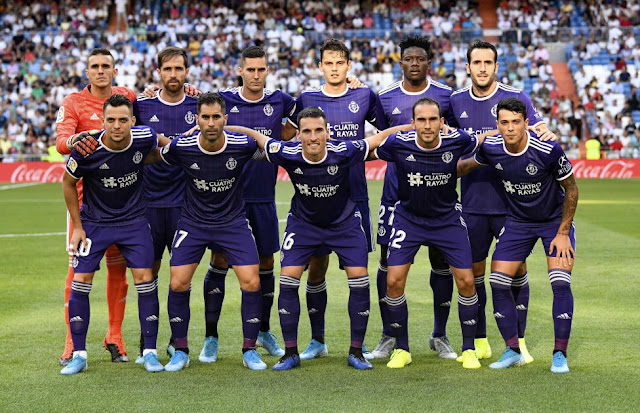 REAL VALLADOLID C. F. Temporada 2019-20. Jordi Masip, Míchel Herrero, Sergi Guardiola, Enel Ünal, Salisú, Kiko Olivas. Óscar Plano, Javi Moyano, Fede San Emeterio, Nacho y Pedro Porro. REAL MADRID C. F. 1 REAL VALLADOLID C. F. 1. 24/08/2019. Campeonato de Liga de 1ª División, jornada 2. Madrid, España, estadio Santiago Bernabeu (63.037 espectadores). GOLES: 1-0: Karim Benzema (81’). 1-1: Sergi Guardiola (88’). ALINEACIÓN: Masip; Javi Moyano (Waldo 59'), Kiko Olivas, Salisu, Nacho; Pedro Porro (Antoñito 80'), Míchel Herrero, San Emeterio (Anuar 84'), Óscar Plano; Ünal y Sergi Guardiola; entrenador: Sergio González.