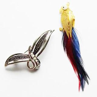 Two bird brooch pins