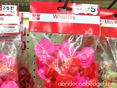 Use Valentine's Day clearance to your advantage when you're wedding planning. After the holiday is over, pick up candles, garland, petals, and more for your red wedding at a fraction of the price. Find out more at www.abrideonabudget.com.
