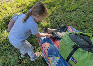 Rosie helps taking the tent down