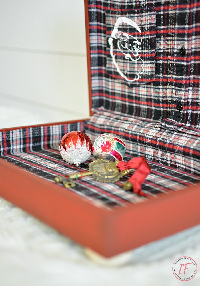 How to upcycle a thrift store flatware box into a festive red Christmas Box and how to line the inside with a flannel shirt for Santa on Christmas Eve.