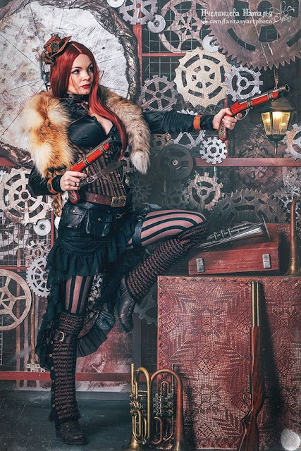 Steampunk redhead female wearing striped corset and stockings, skirt, blouse and fur wrap