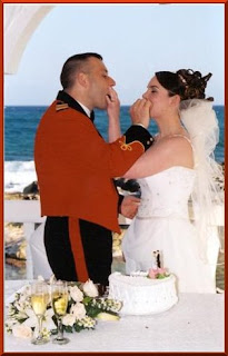 Feeding each other wedding cake