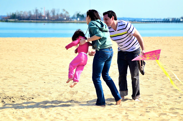 A family plays at Orchard Beach, Bronx, NY