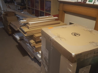 Piles of boxes that made up the jigsaw that is my kitchen