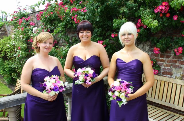 The exquisite Bridesmaids dressed in purple with Pink Purple bouquets
