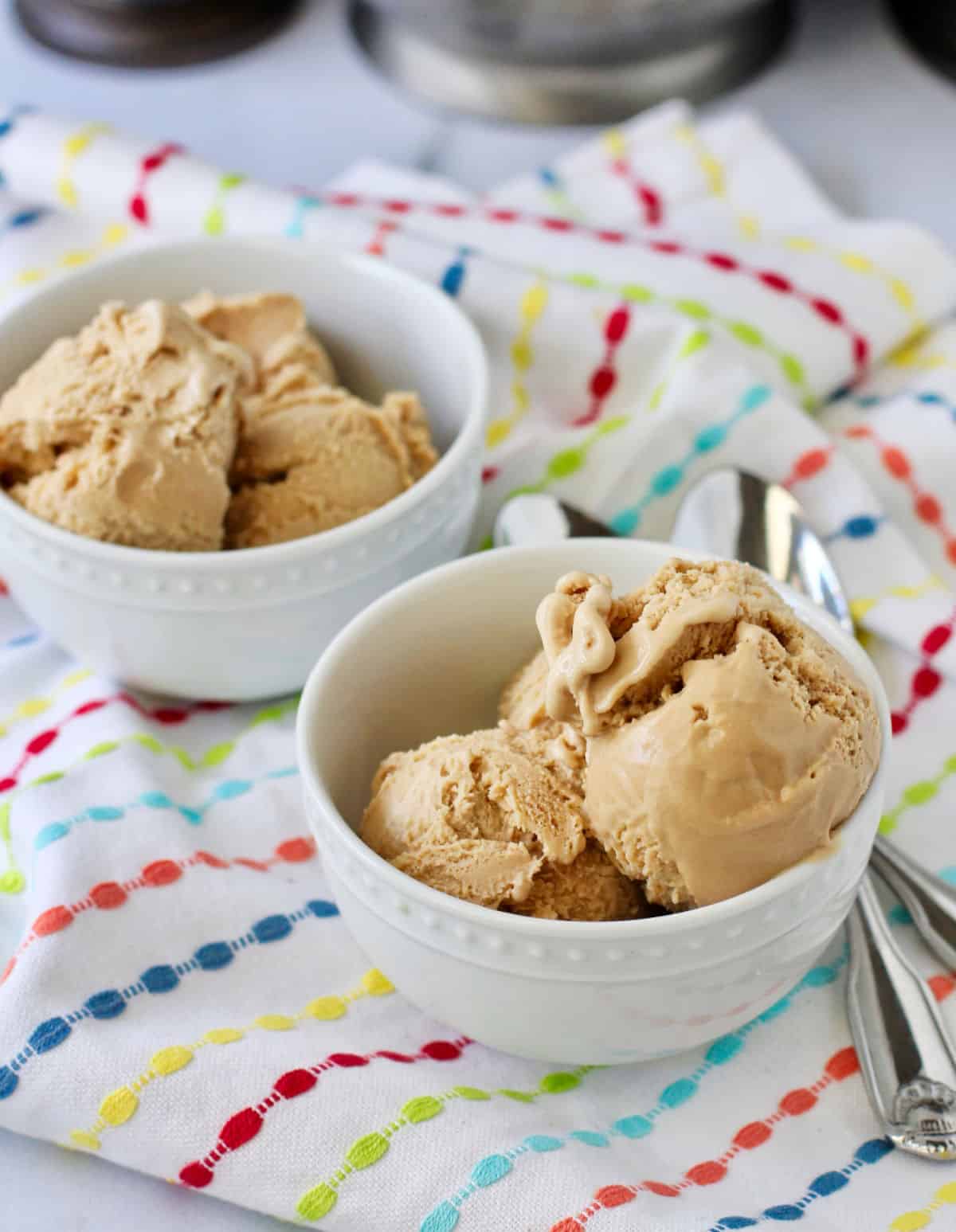 Coffee ice cream in two white bowls.