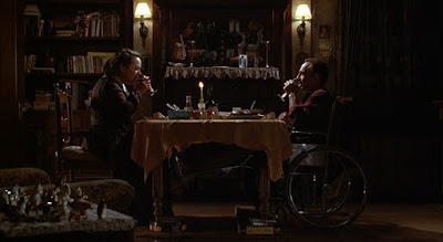 Misery 1990 movie scene where Kathy Bates's Annie Wilkes and James Caan's wheelchair-bound Paul Sheldon enjoy a lovely candelit dinner together