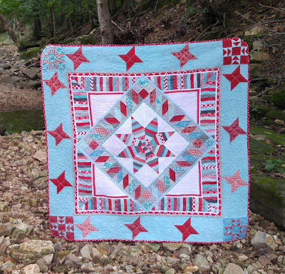 Red and aqua round robin quilt